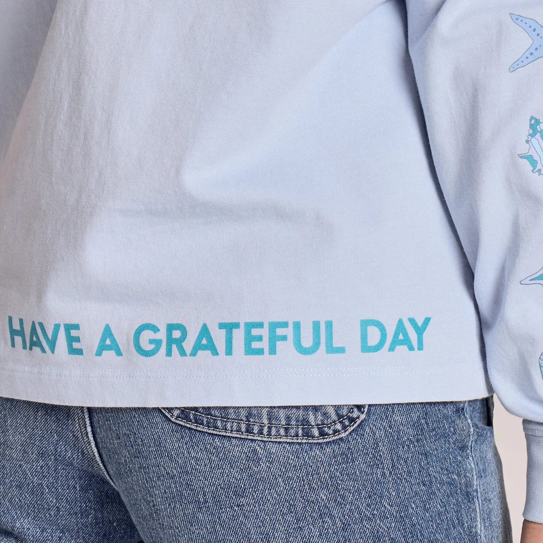 Life is Good W LS Crusher Grateful Day Message Tee GLACIER BLUE